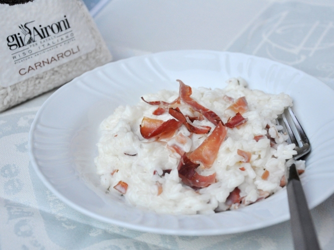 Risotto cremoso con speck, robiola e rosmarino